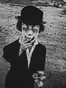 A sad little clown who appears to be a little sad.